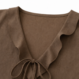 Vellara – Sleeveless Ruffle V-Neck Blouse with Bow Tie and Peplum Hem