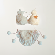 White plushie with teddy face