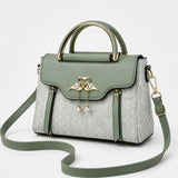 Velora – Swan-Clasp Structured Crossbody Bag with Gold Hardware