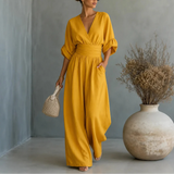 Soléra – Wide Leg V Neck Jumpsuit with Pleated Waist Sash